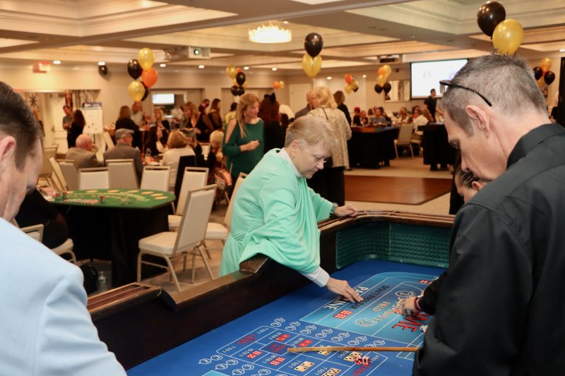 Carol Sink hopes for a monumental win at the craps table, dressed as the Statue of Liberty.